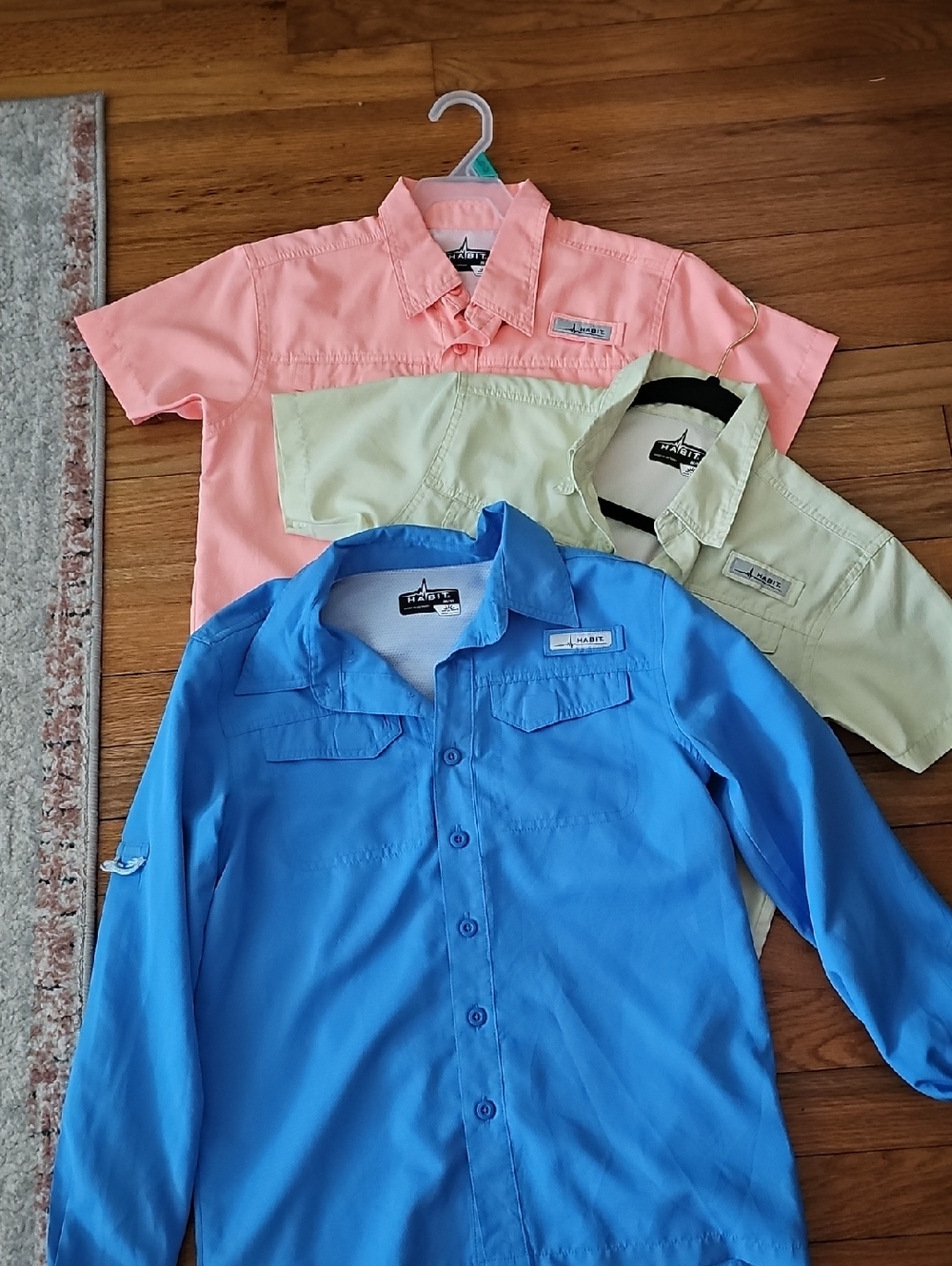 Habit Kids Short & Long Sleeve Shirts in Blue, Coral, and Light Green.